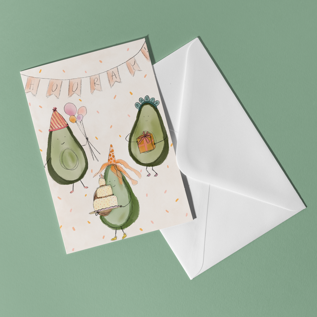 Greeting card with avocado illustrations and a white envelope on a green background